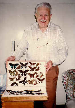 Richard Cranmer (Tim) Dening with one of his cases of butterfly specimens.